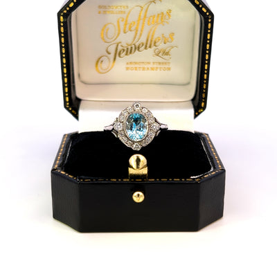 White Gold Ring With Oval Mixed-Cut Aquamarine and 16 Brilliant-Cut Diamonds