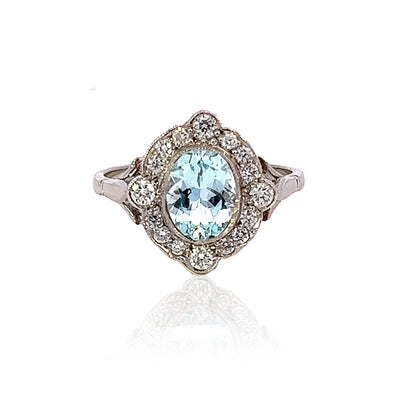 White Gold Ring With Oval Mixed-Cut Aquamarine and 16 Brilliant-Cut Diamonds