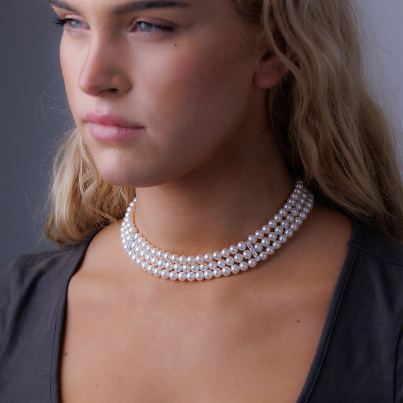 3 strand Pearl Necklace with White Gold and Diamond Spacer Bars.