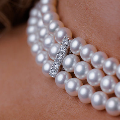 3 strand Pearl Necklace with White Gold and Diamond Spacer Bars.