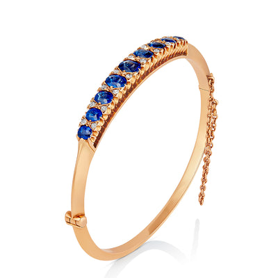 Early 20th Century Rose Gold Bangle With 9 Mixed-Cut Sapphires
